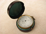 Antique pocket barometer with 19th century Freiburg Black Forest carved holder
